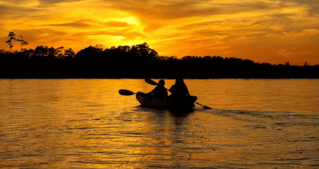 Kayaking NC mountains at sunrise on Fontana Lake
