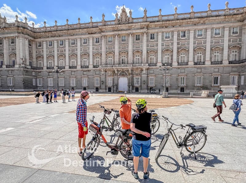 e-bike tour stopping outside of the palace in Madrid for a quick lesson from the guide.