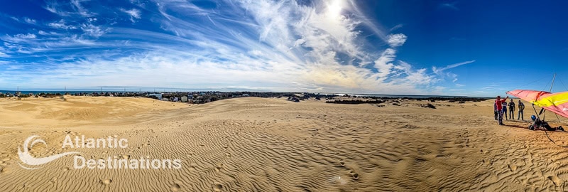 Beach dunes and expansive sky at Atlantic Destinations, Atlantic City, perfect for relaxation and seaside adventures.