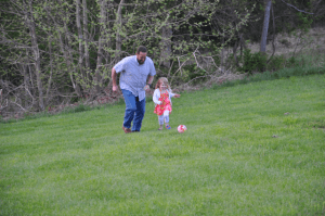 Kicking a ball in view foreground