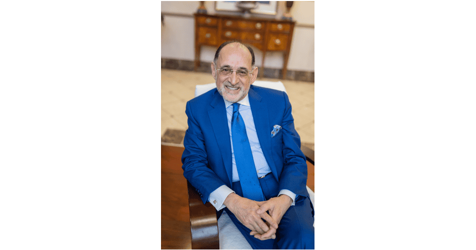 Michael Shellenberger smiling in a blue suit at Atomic Insights event.