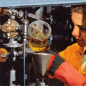 Figure 3. At Oak Ridge in 1953, Richard Engel adds 300 g of uranium in 500 ml of heavy water to generate electric power for 2 months, doing the work of 1,000 tons of coal.