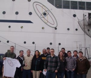 SUNY Senior Designers Outside NS Savannah Under Atomic Logo