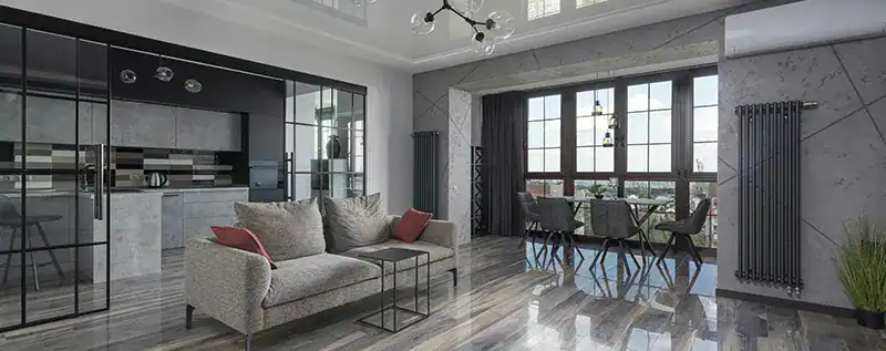 Salón moderno con cocina y ventanales grandes