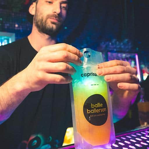 a cocktail in a bag being made at the bar