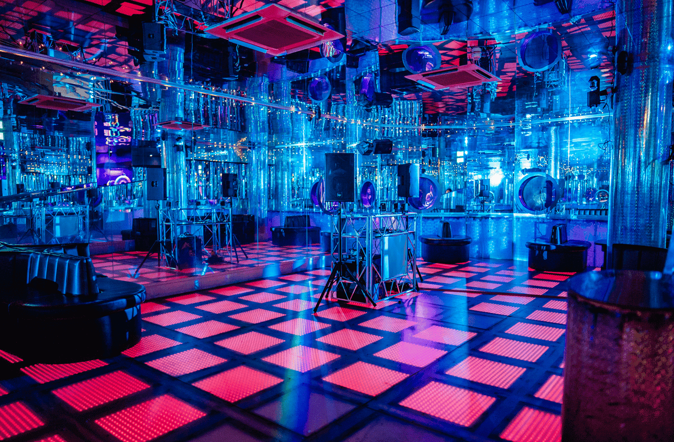 Vibrant scene at Ballie Ballerson with friends enjoying a lively night in the famous London ball pit bar.