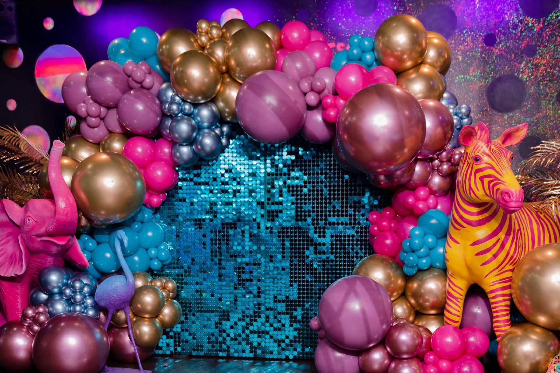 Vibrant ball pit with colourful LED lighting at Ballie Ballerson, a popular London nightlife and entertainment venue.