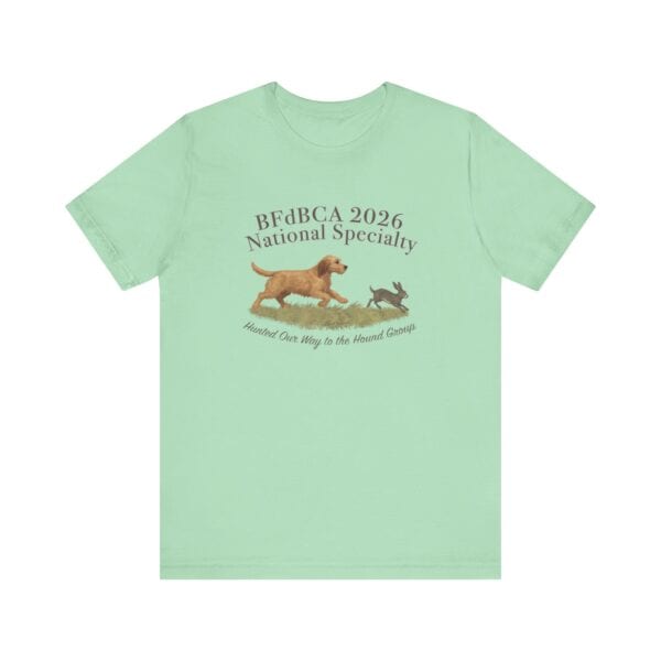 Mint green shirt with dog and rabbit graphic.