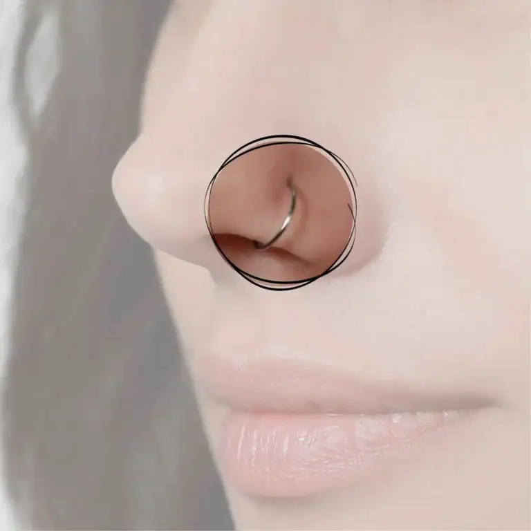 Ein Nostril-Piercing an der Seite der Nase, elegant hervorgehoben durch einen kleinen, glänzenden Stud, der einen dezenten, aber markanten Akzent setzt.