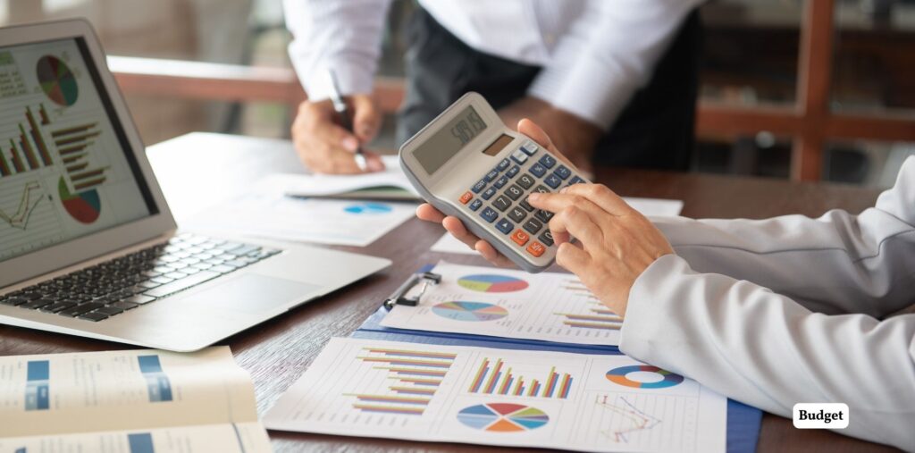 Master Interior Design Using AI: Simple Steps for Stunning Spaces 2 Office workspace with financial charts and calcula.