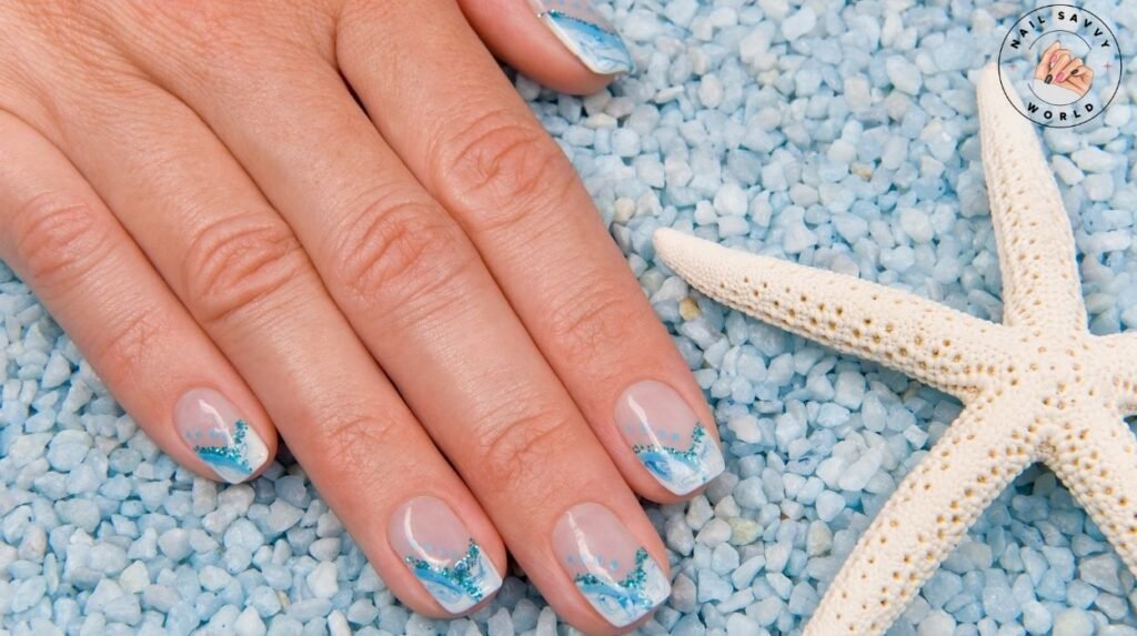 Healthy summer nails with coral polish, protected with SPF nail oil, styled beside beach essentials for seasonal nail care and shine.