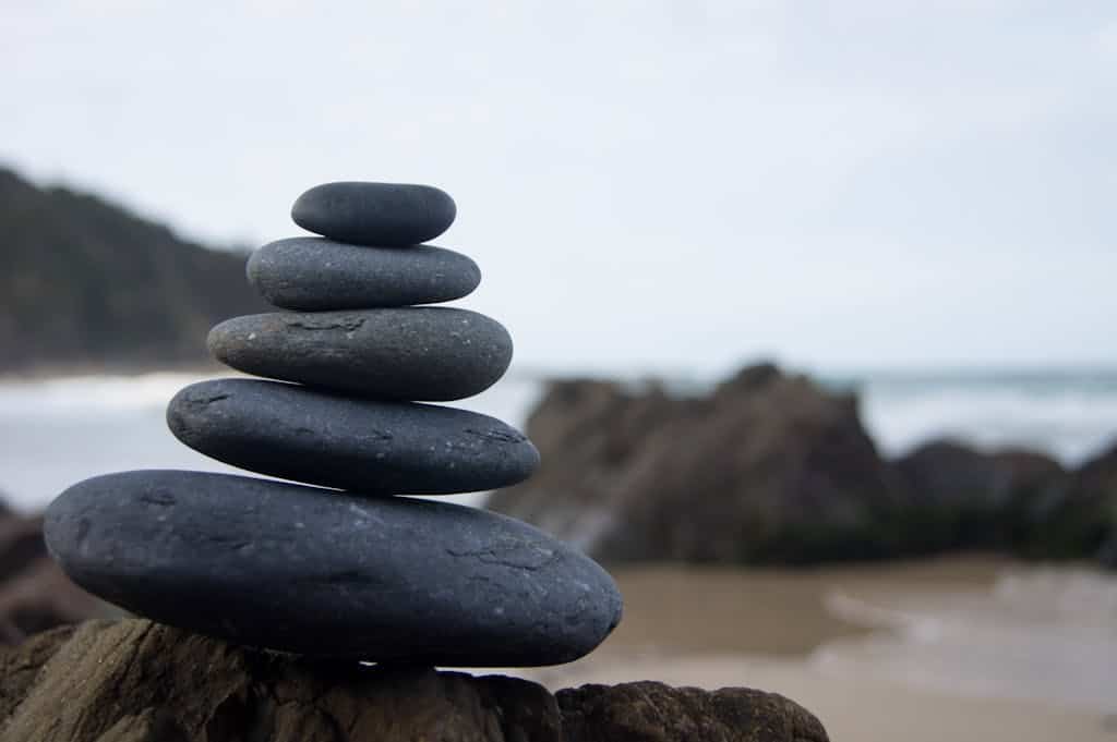 Photo of Stacked Rocks Near Shore