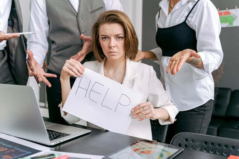 A Woman Holding a Sign for Help