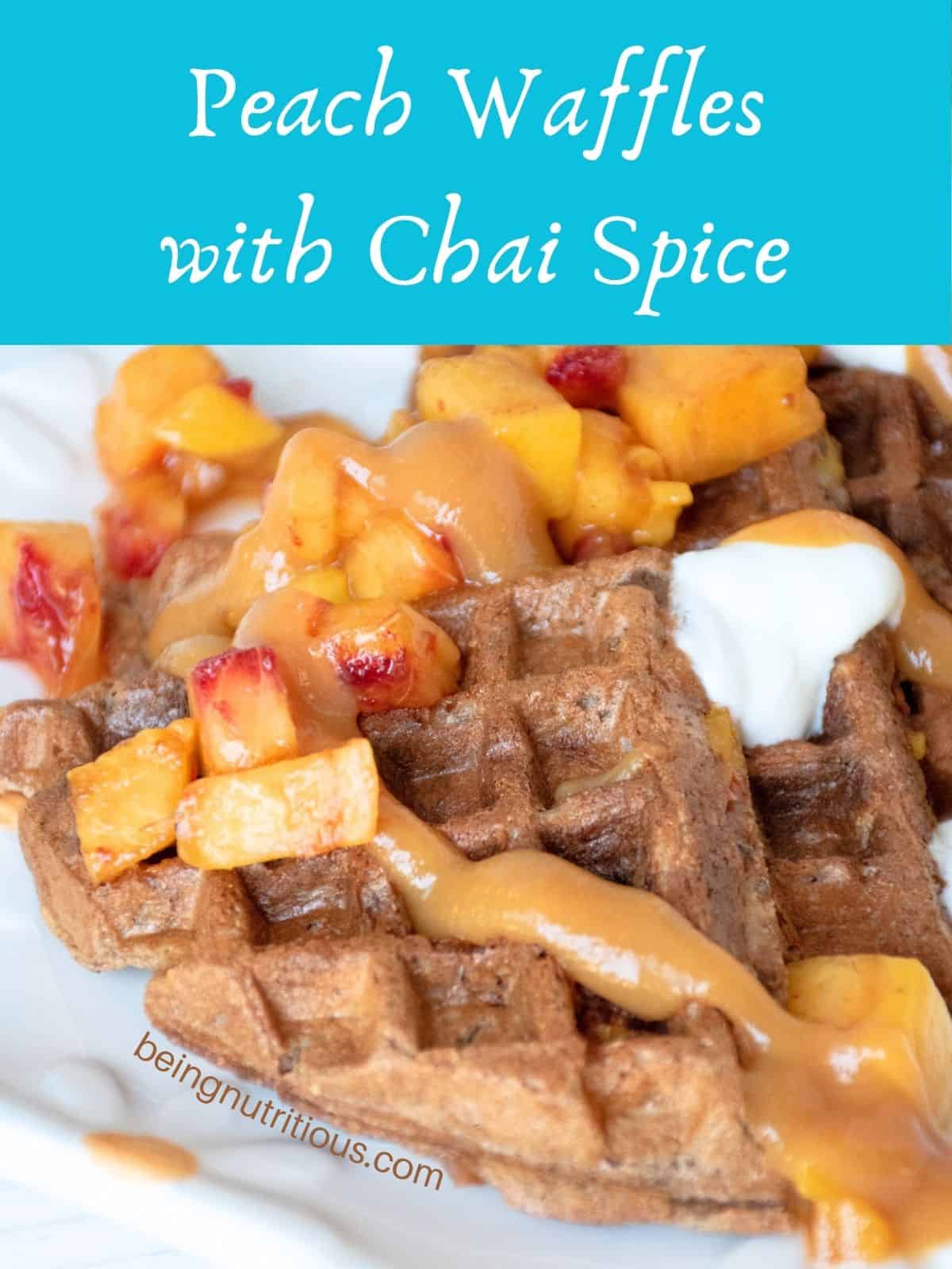 Waffle quarters, arranged on a serving dish, and garnished with chopped fresh peaches, dollops of yogurt, and peach syrup. Text overlay: Peach Waffles with Chai Spice.