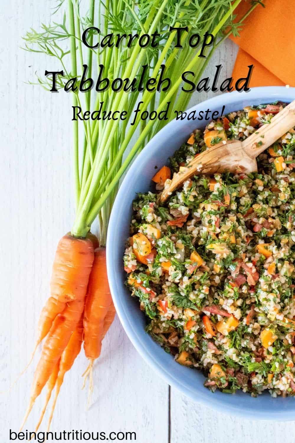 Overhead shot of carrot top salad in a blue bowl, half of the bowl shown, with a bunch of carrots with the tops still attached lying beside the bowl. Text overlay: Carrot top tabbouleh salad; Reduce food waste!