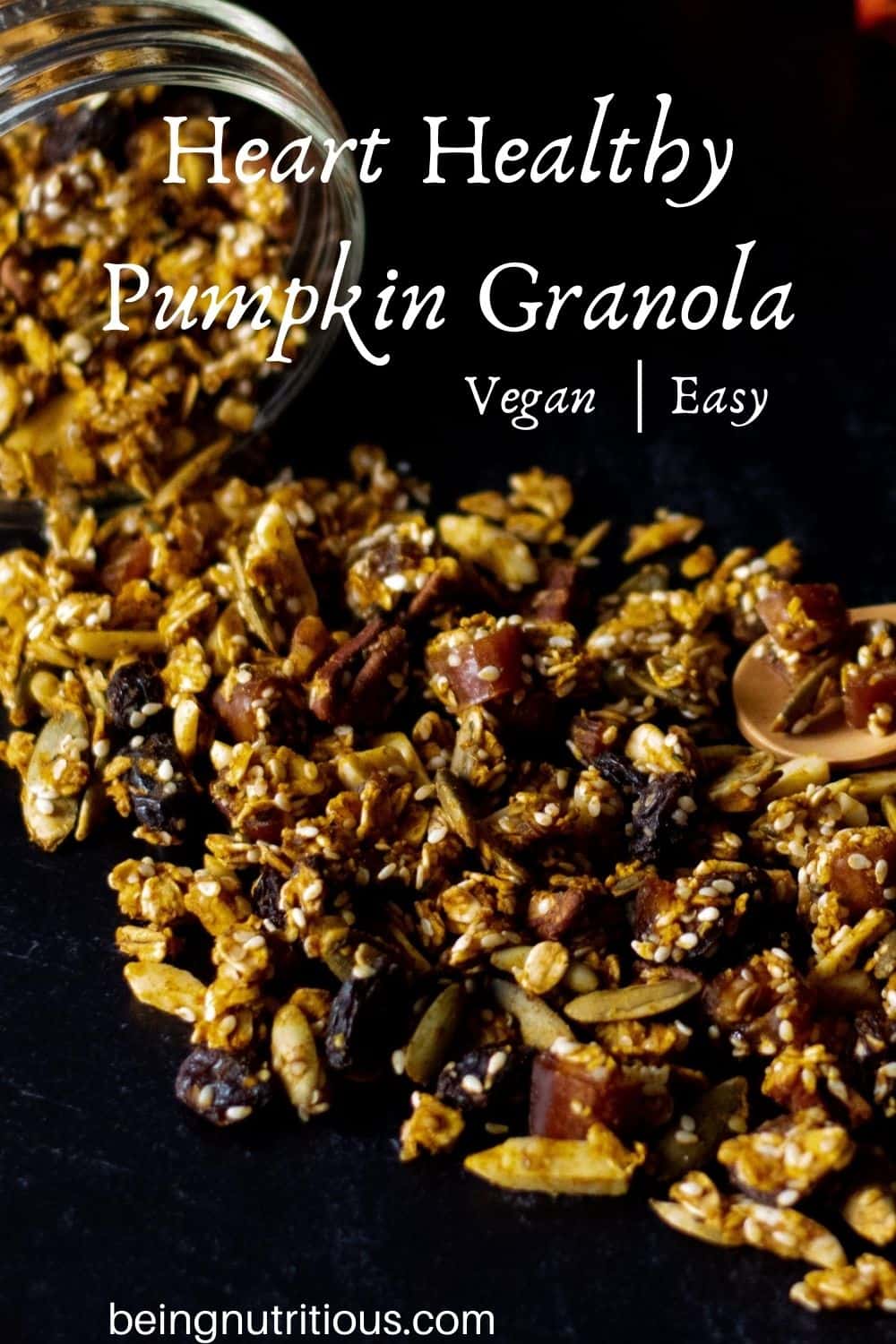 Granola spilling out of a Mason jar on a black background with text overlay: Heart Healthy Pumpkin Granola, vegan, easy.