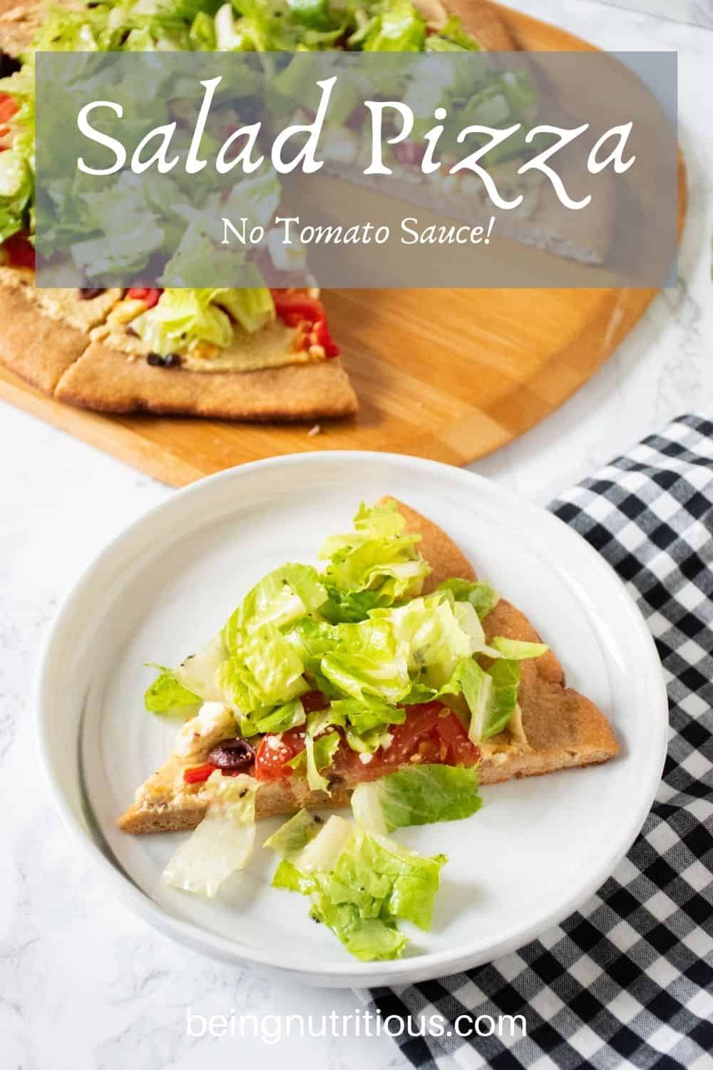 Slice of pizza on a plate. In background is the rest of the pizza on a peel, with whole wheat crust, topped with salad. Text overlay: Salad Pizza, No Tomato Sauce!
