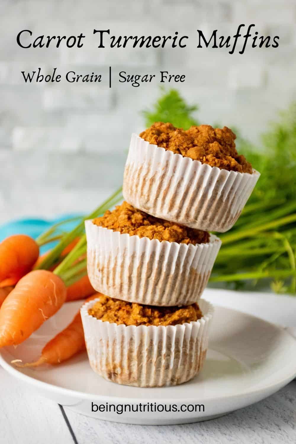 Stack of 3 muffins on a plate with fresh carrots in the background. Text overlay: Carrot Turmeric Muffins; whole grain, sugar free.