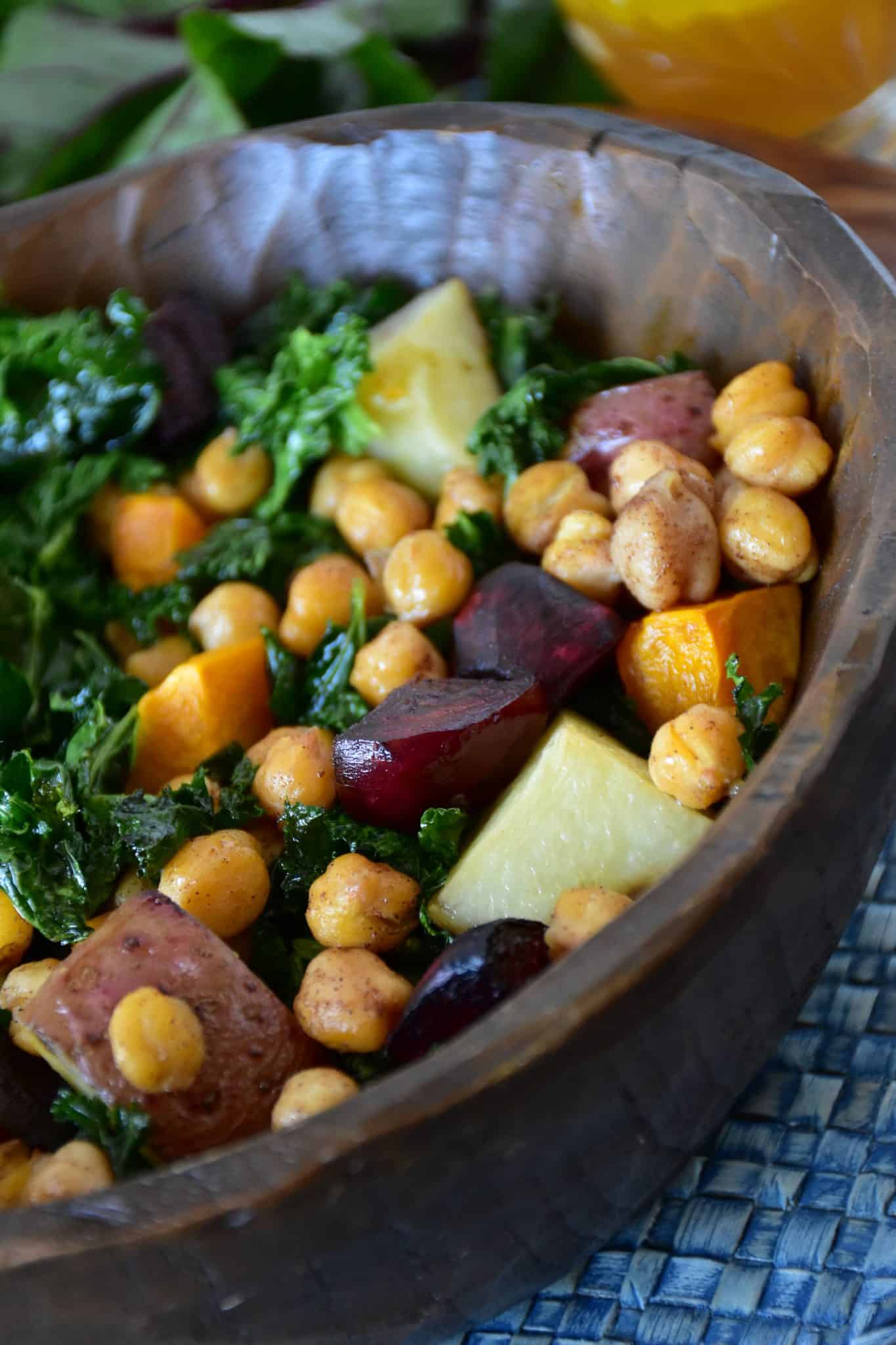 Kale salad in a wooden bowl.