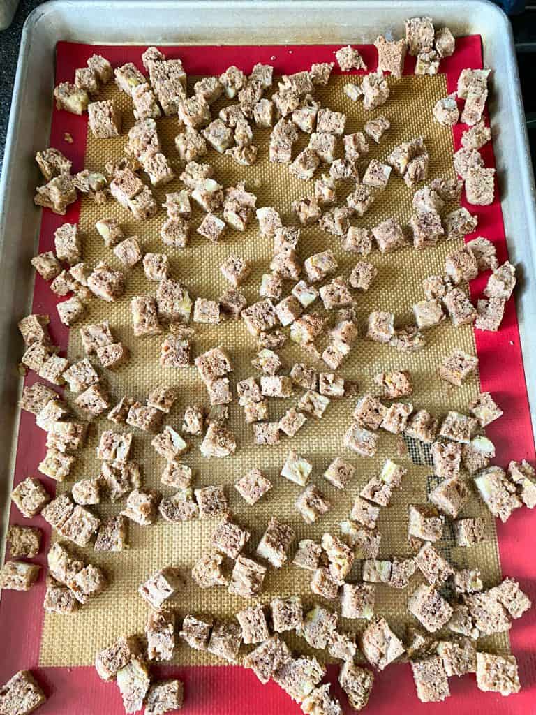 Cubes of bread on cookie sheet