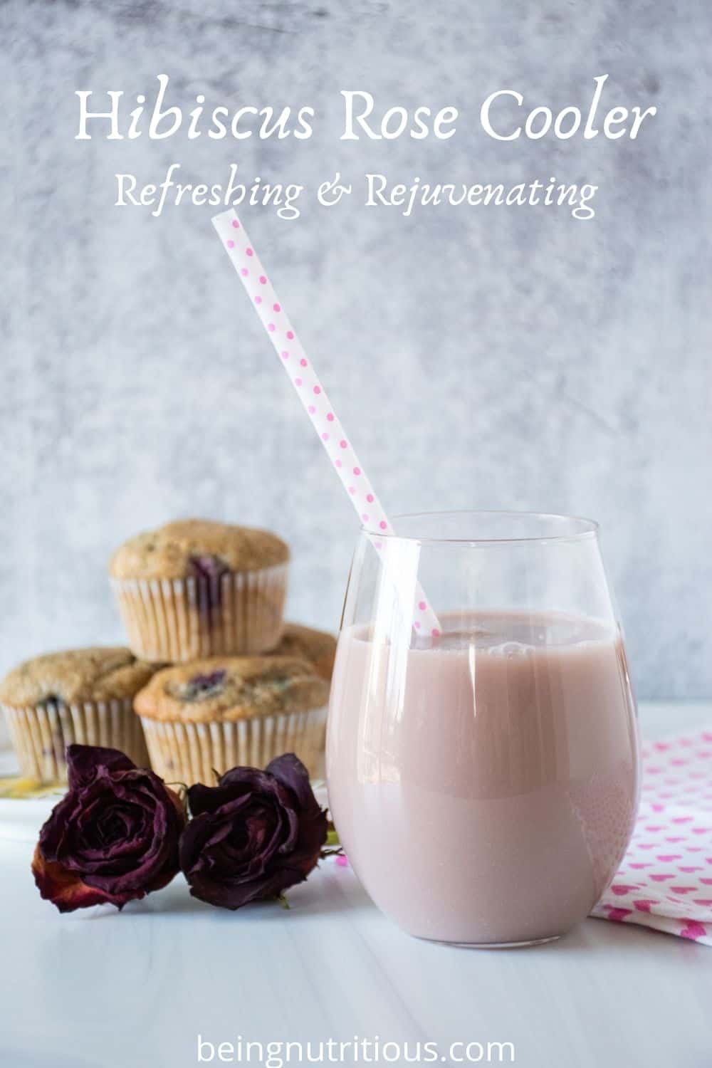Glass of pink beverage. Text overlay: Hibiscus Rose Cooler; Refreshing & Rejuvenating.