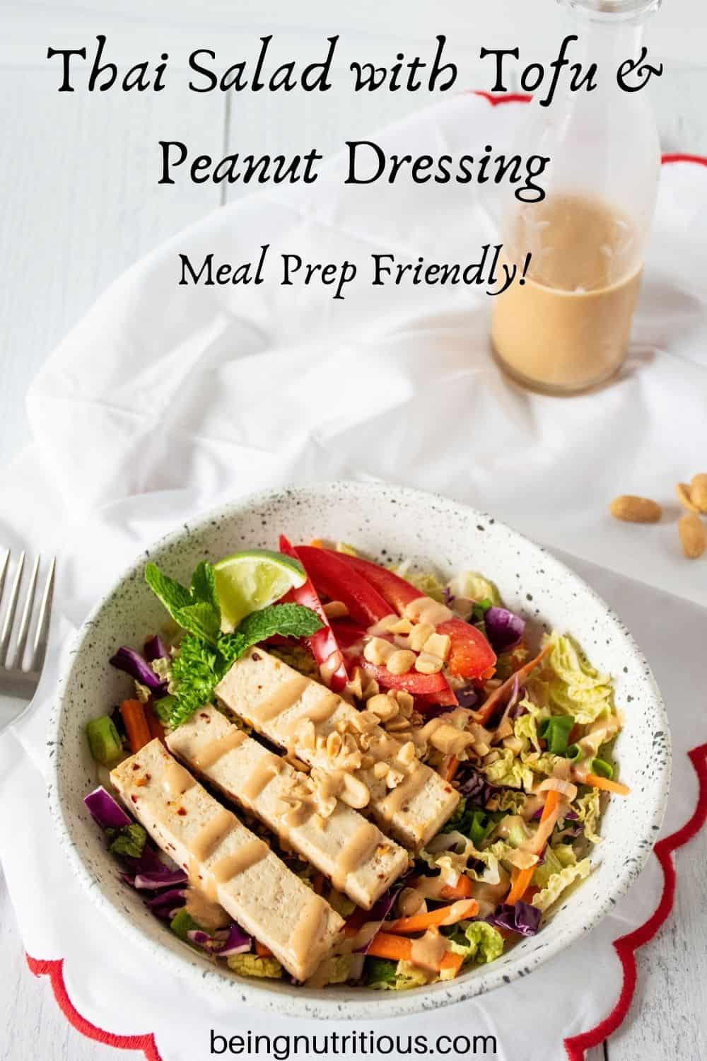 Bowl of Thai salad. Text overlay: Thai Salad with Tofu and Peanut Dressing; Meal Prep Friendly.