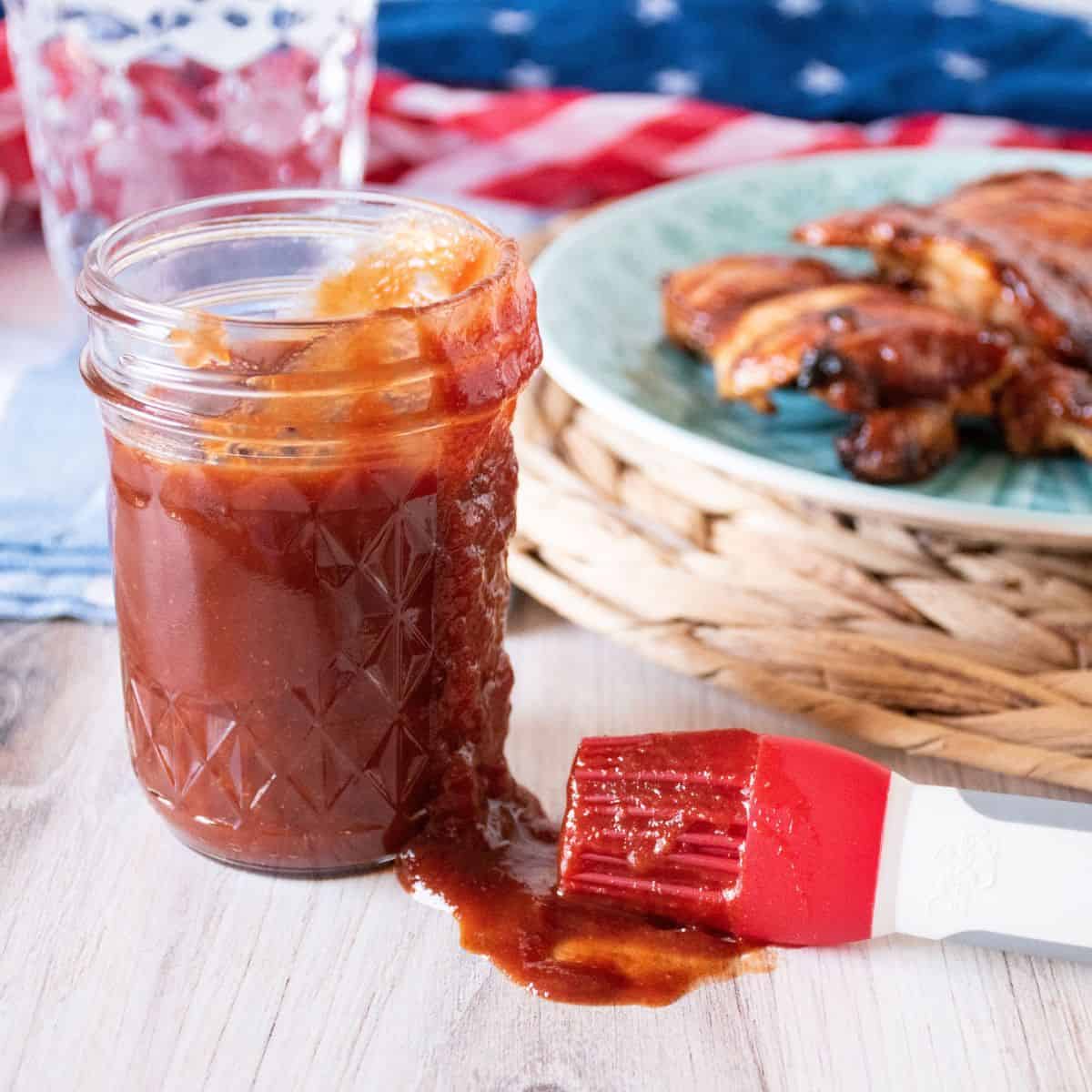 Close up of a jar of BBQ sauce.