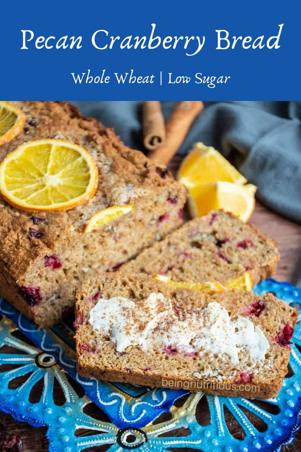 Tray of sliced quick bread, one with butter and cinnamon sprinkled on. Text overlay: Pecan Cranberry Bread, whole wheat, low sugar.