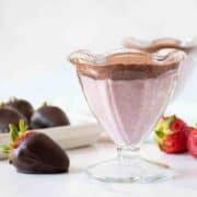 Dessert cup with strawberry and chocolate pudding in it.