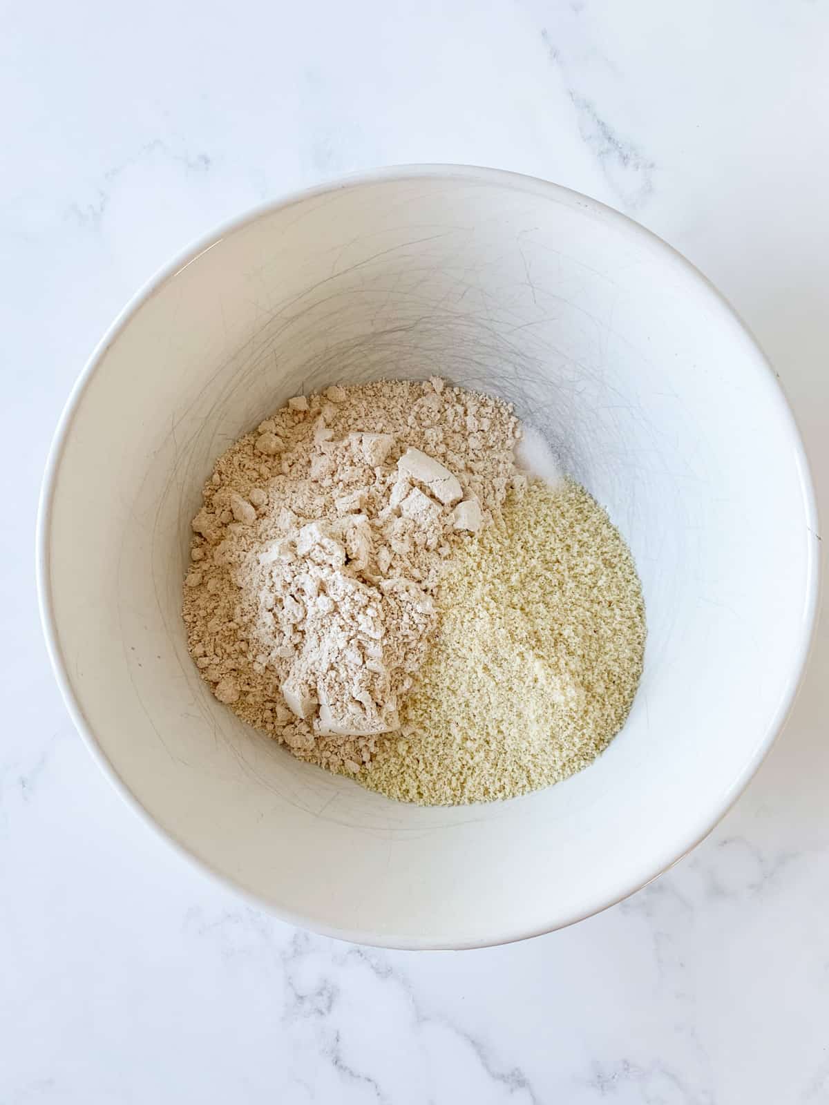 Dry cookie ingredients in a bowl.