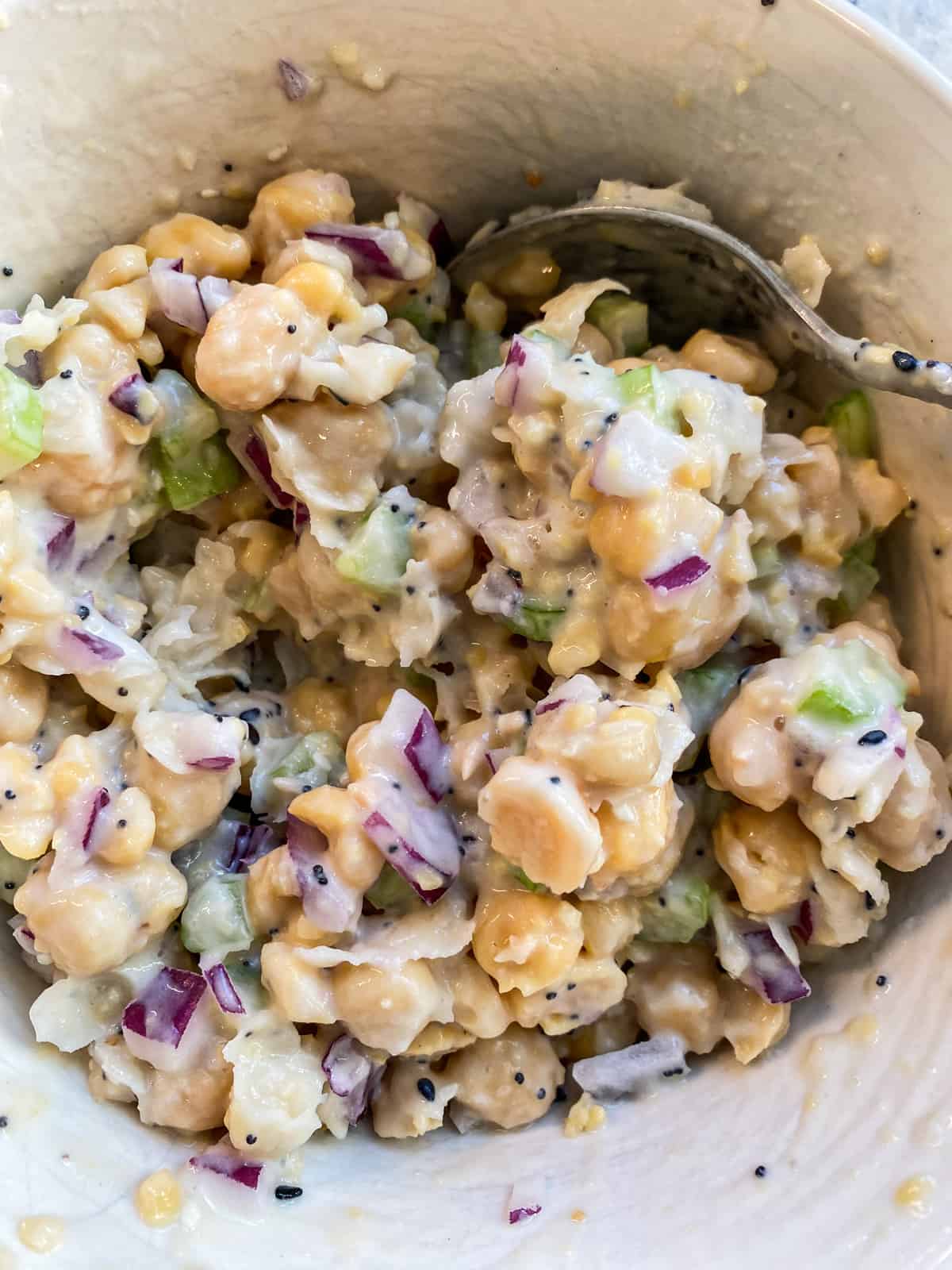 Chickpea salad, completely mixed and ready to eat.