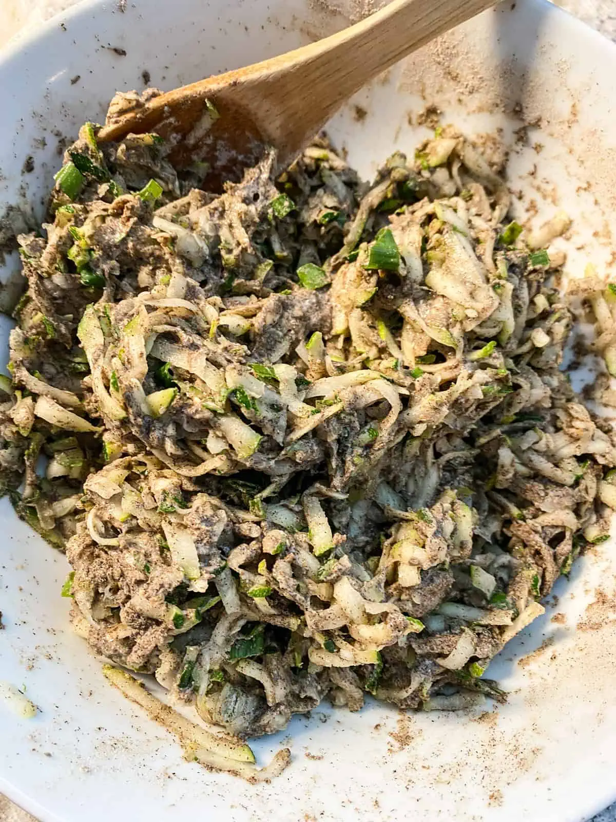 All fritter ingredients mixed together in a bowl.