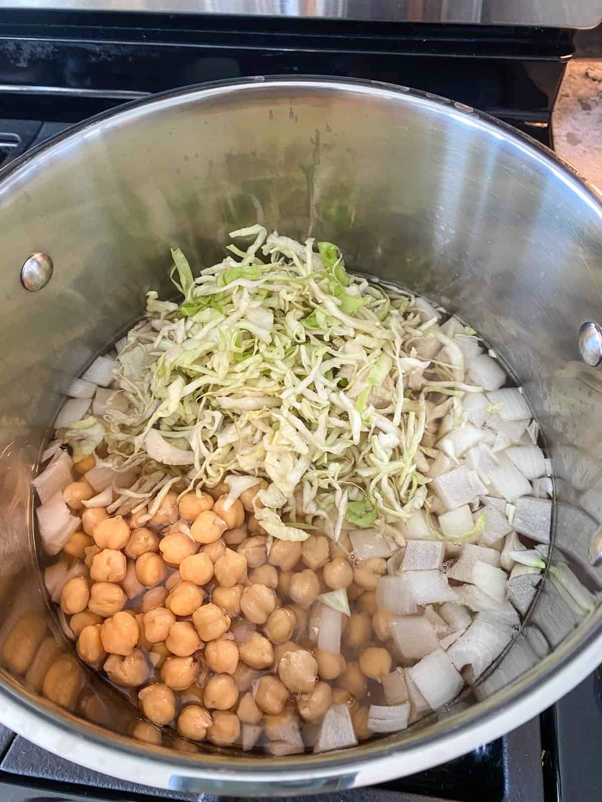 Cabbage added to the stew.