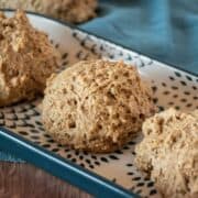 Whole wheat drop biscuits on a serving tray.