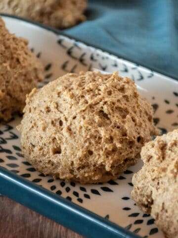 Whole wheat drop biscuits on a serving tray.