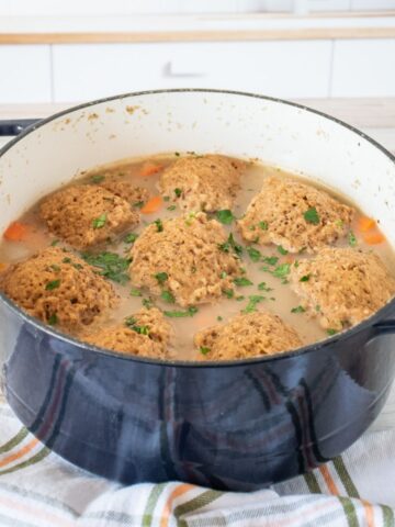 Pot of vegetable stew with soda bread dumplings.