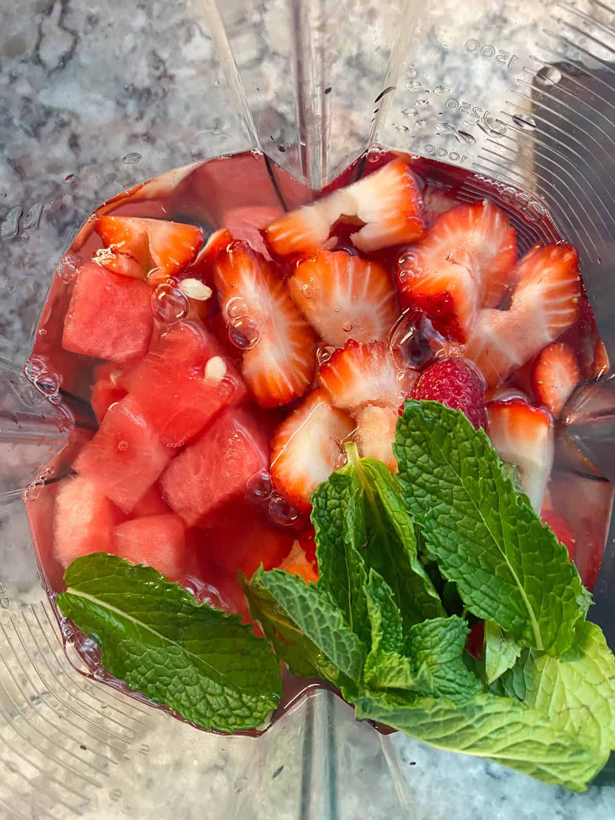 Whole agua fresca ingredients in a blender.