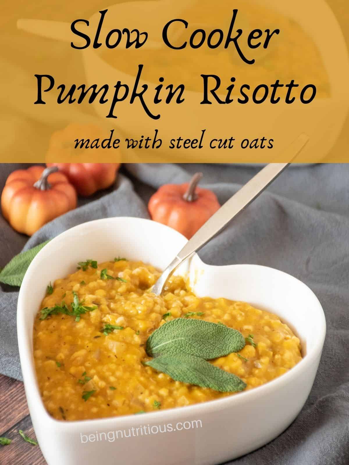 Risotto in a heart shaped bowl, garnished with fresh sage leaves and chopped parsley. Text overlay: Slow Cooker Pumpkin Risotto, made with steel cut oats.
