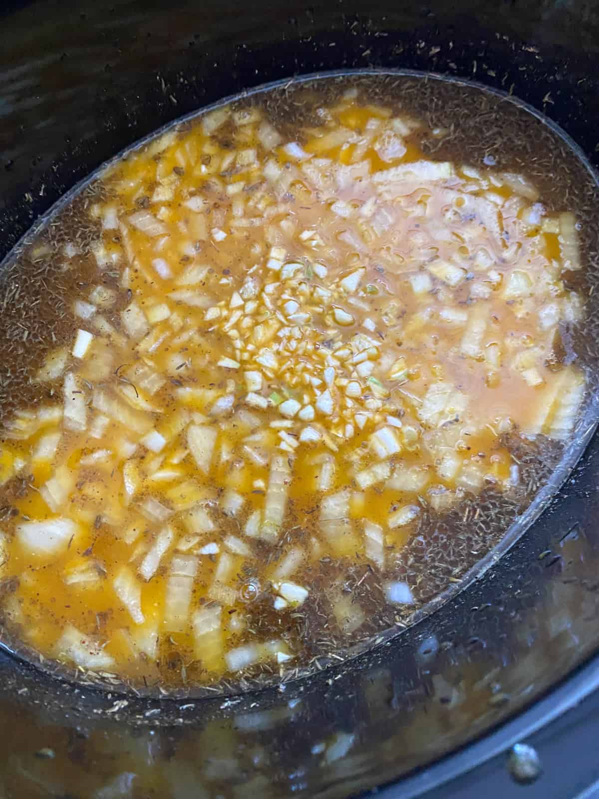 All risotto ingredients, except oats, combined in a slow cooker crock.