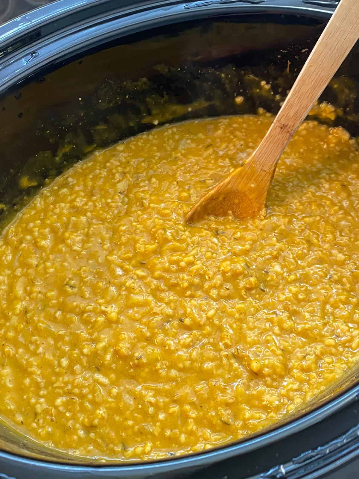 Finished risotto dish in a slow cooker crock.