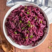 Overhead image of a bowl of cooked red cabbage.