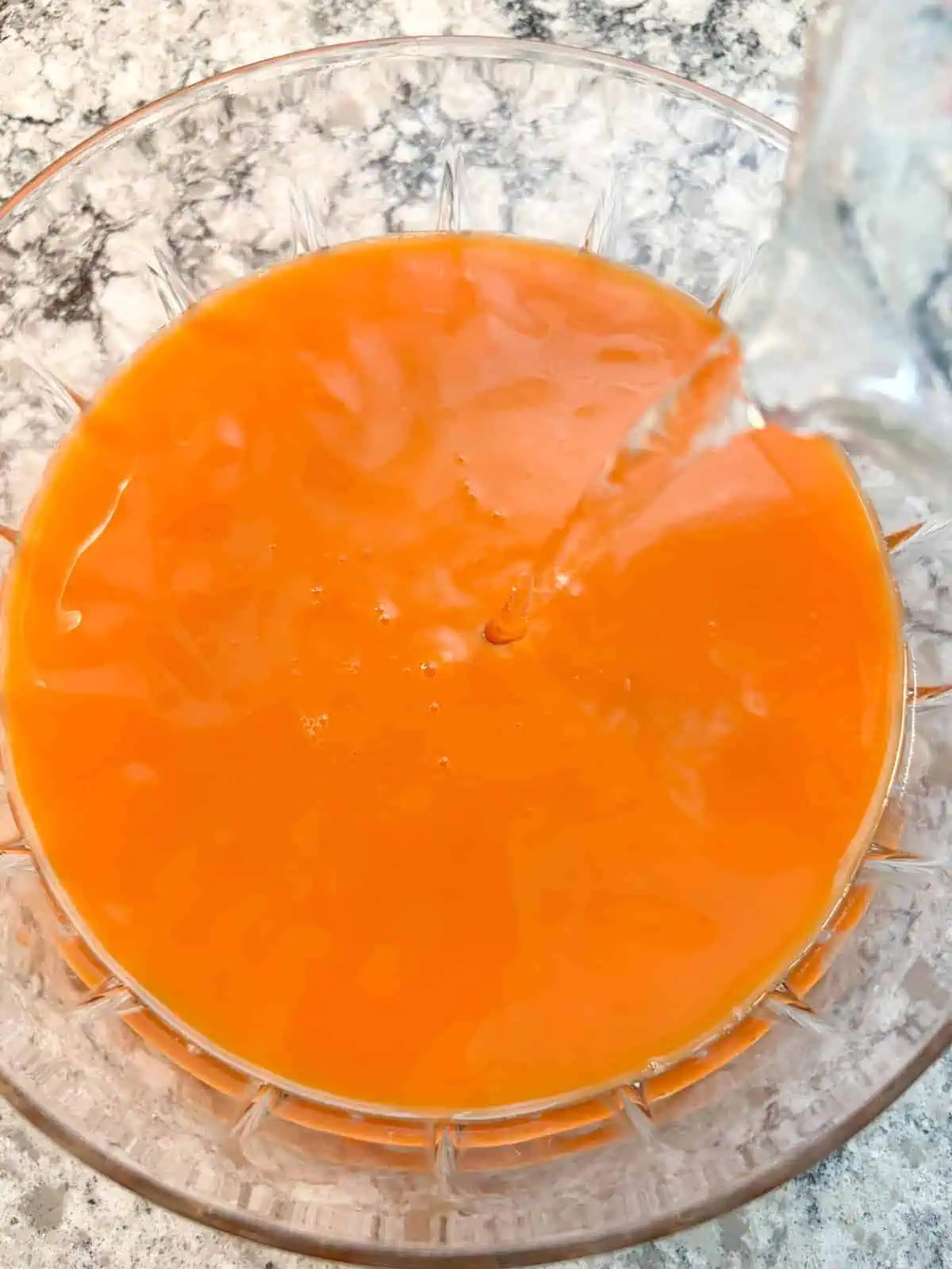 Seltzer water being poured into the punch bowl.