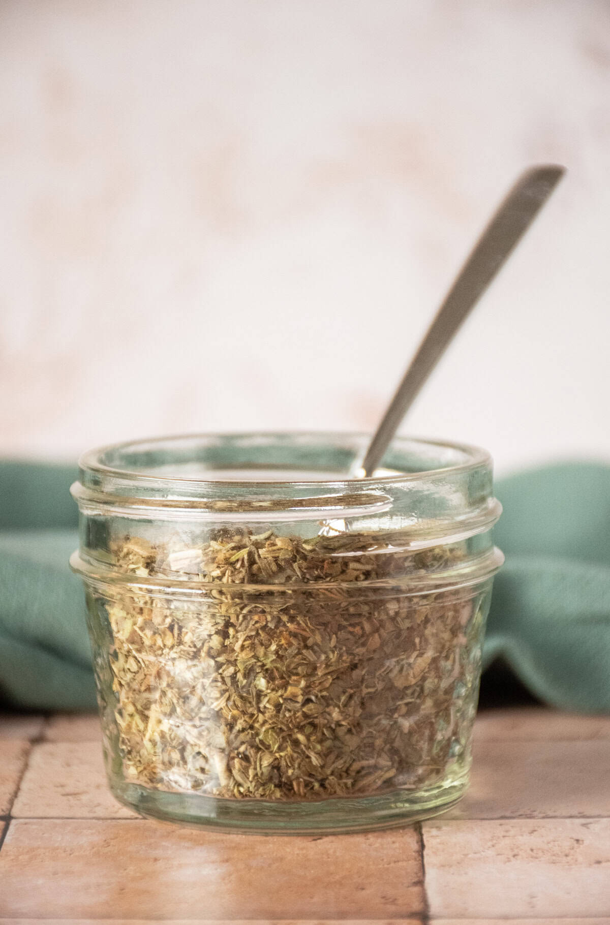 Small jar of Italian seasoning.