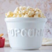 Ceramic bowl of popcorn.