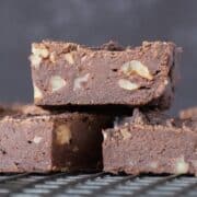 Side view of cut brownies on a cooling rack.