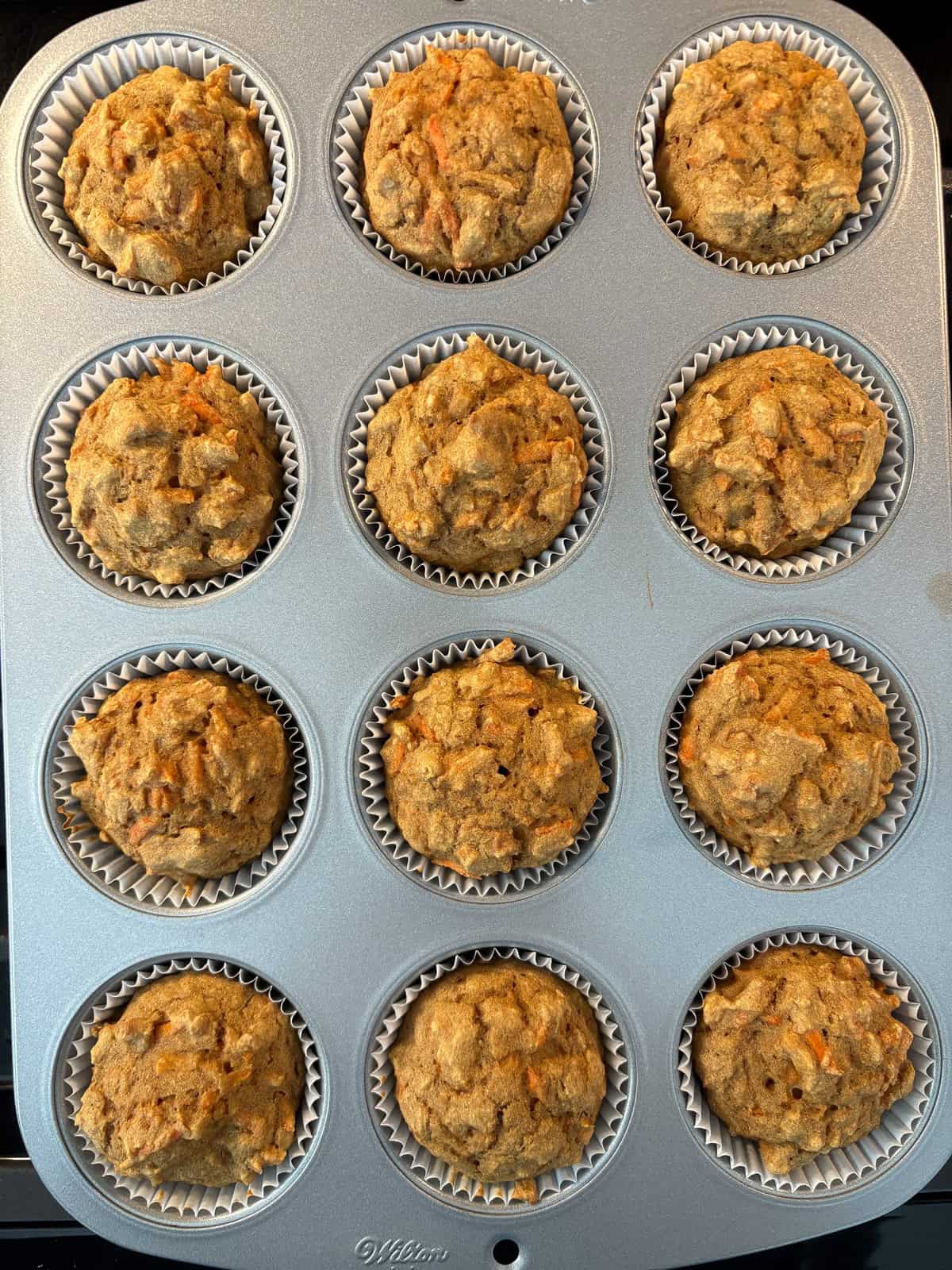 Baked muffins, still in the pan.