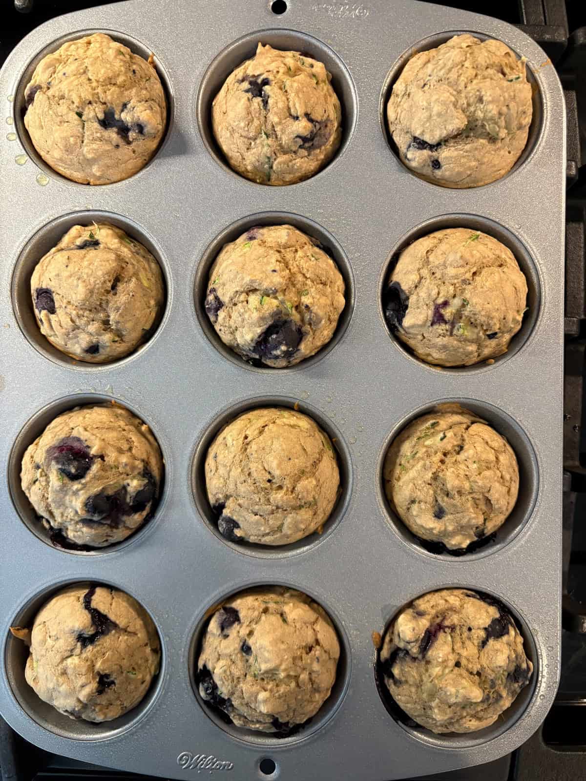 Baked muffins, still in muffin tin.