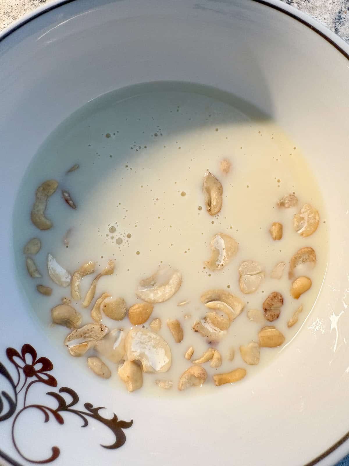 Raw cashews soaking in soy milk.