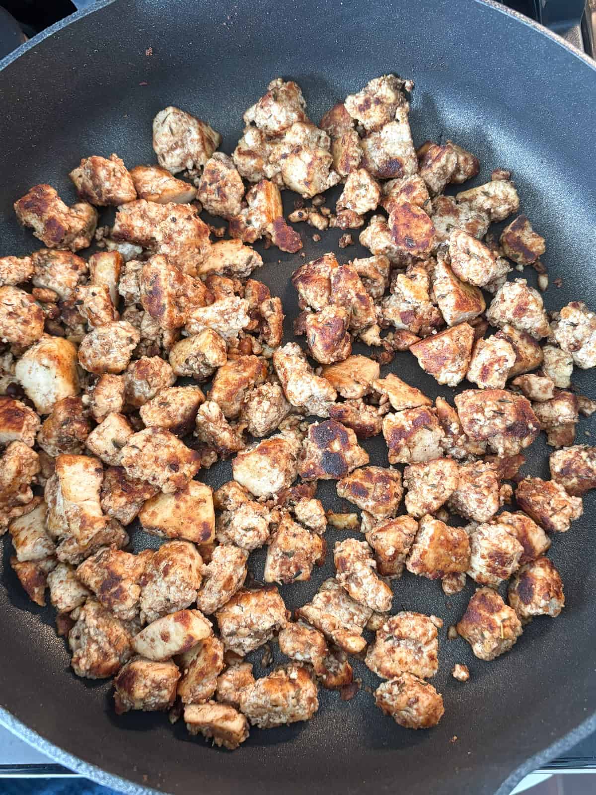 Crispy jerk tofu in a pan.