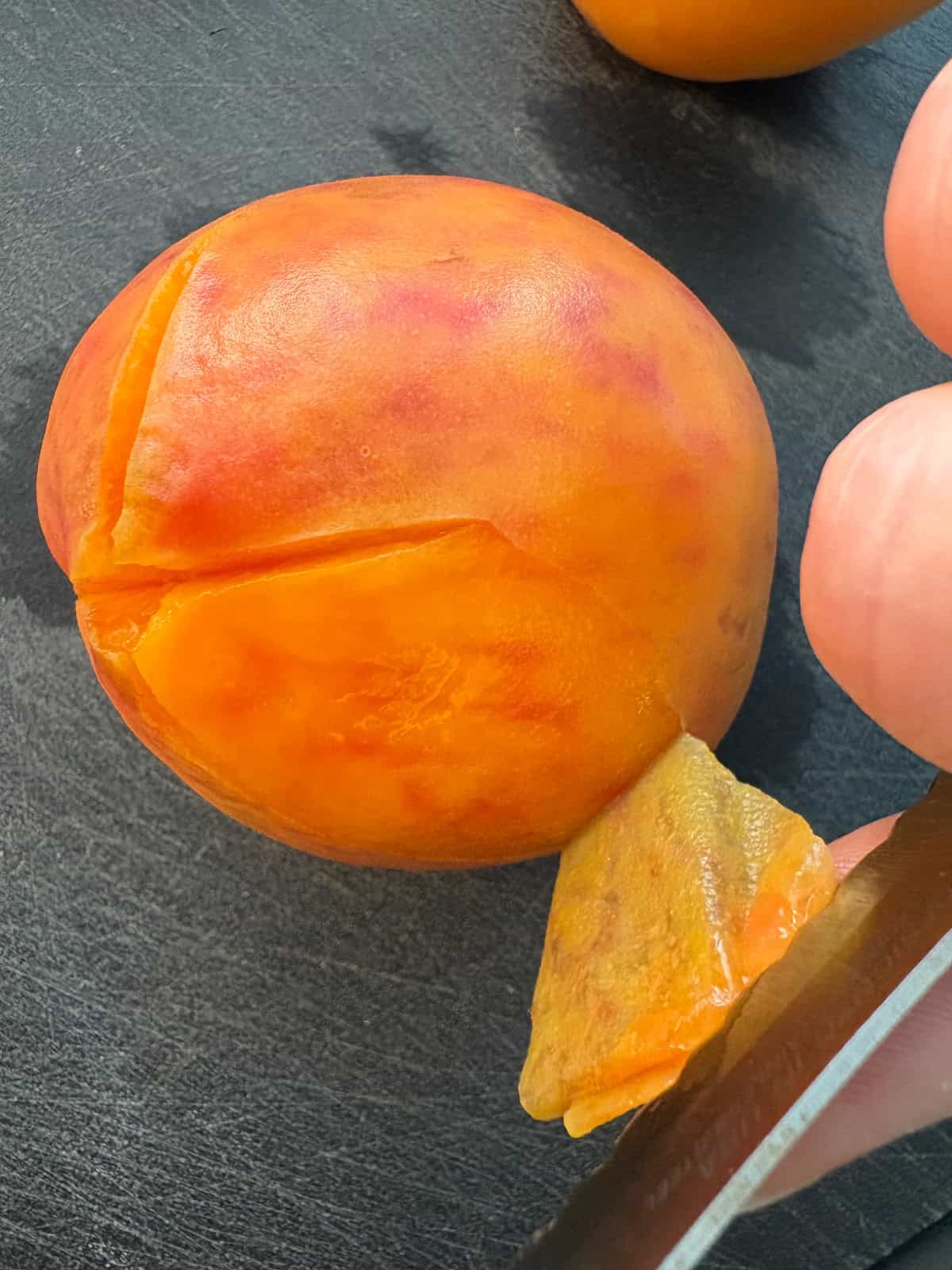 Peach being peeled.